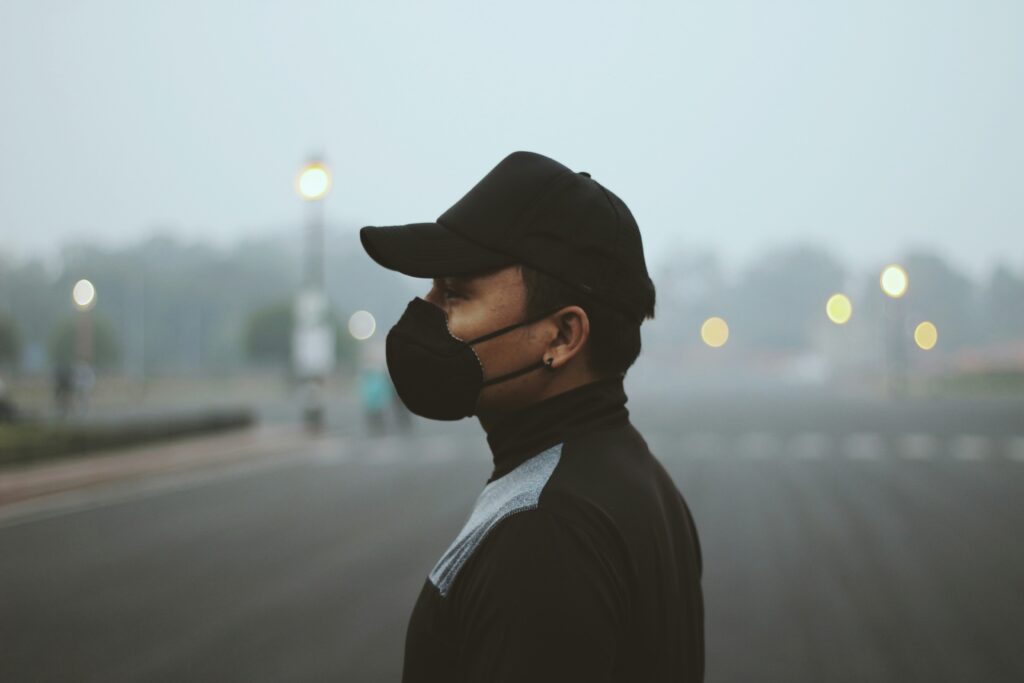 A man wearing a mask to safeguard himself from air pollution